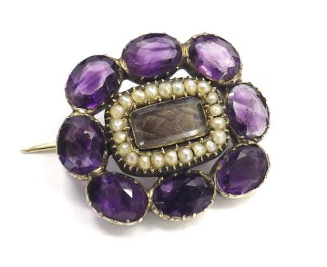 Antique amethyst and seed pearl brooch, the centre with a lock of hair panel set in yellow gold, 23mm x 26mm 