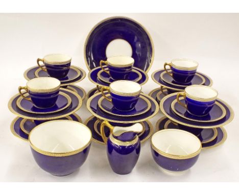 Royal Worcester 1920s part tea service, decorated in cobalt blue with enamel beaded and gilt borders, comprising twelve tea c
