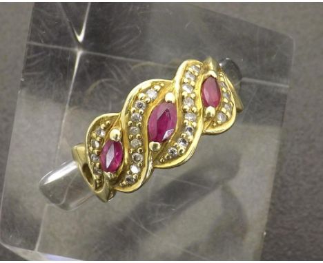 18k ruby and diamond cross-over design band ring, 6.4gm, ring size P