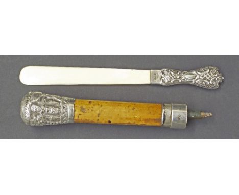 Late 19th century silver handle page turner, embossed with various gold cartouche and diaper panels, 8.25" long; together wit