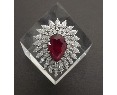 Large 18k white gold ruby and diamond pear shaped cluster ring, the central ruby within a surround of round-cut diamonds, 0.7