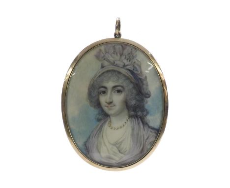 19th century gold mounted miniature oval pendant/brooch, depicting a portrait on ivory of a lady, the reverse inset with a ha