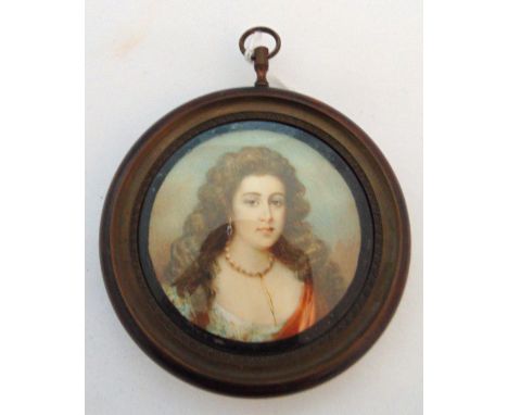 A framed circular portrait miniature of a lady with long hair wearing a pearl necklace, image 6cm (d) frame 9cm (d)