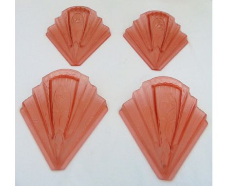 A set of four Art Deco pink stepped fan shaped glass shades
