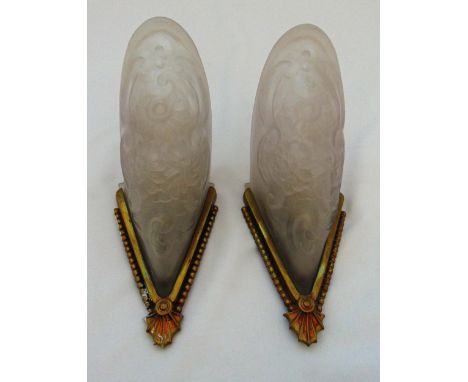 A pair of Art Deco frosted glass wall lights of lozenge form with metal mounts