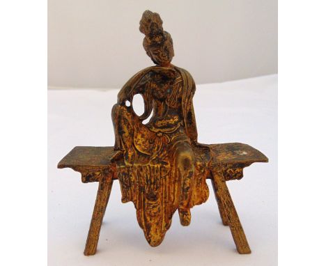 A Chinese gilded metal Buddha seated on a bench, 13.5 x 11 x 4cm
