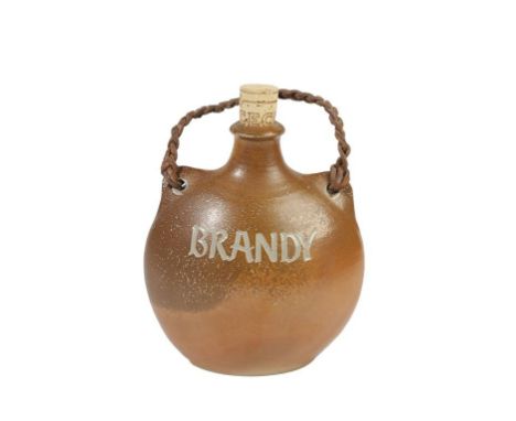 GUY SYDENHAM (1916-2005): A SALT GLAZED "OWL" FLASK, oviod form, inscribed "Brandy" , with leather braided handle, produced o