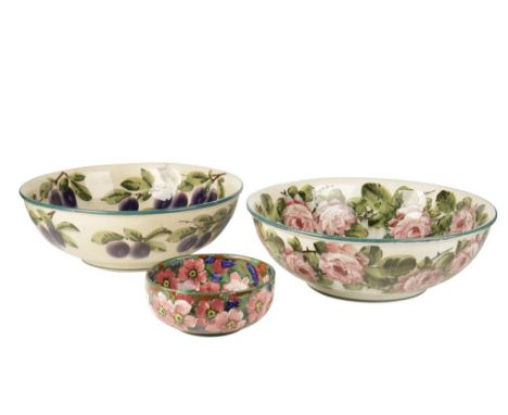 WEMYSS: A LARGE CERAMIC BOWL, circular form, painted in polychrome, decorated with plums and leaves, 39cm diameter, another d