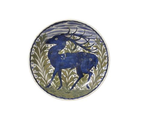 JOHN PEARSON (1859-1930) A CERAMIC SHALLOW DISH, circular form, painted in polychrome, decorated with a stag amongst ferns, p