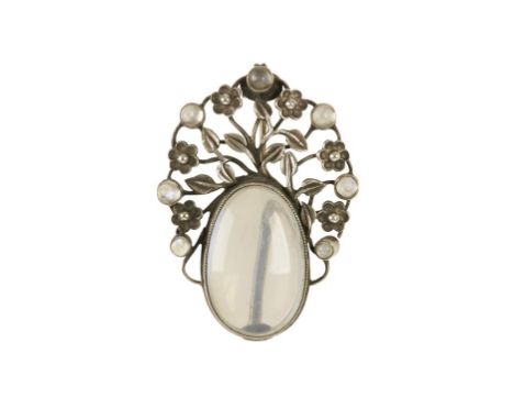 IN THE MANNER OF DORRIE NOSSITER/SYBIL DUNLOP: AN ARTS AND CRAFTS SILVER AND MOONSTONE BROOCH set with seven small cabochons,
