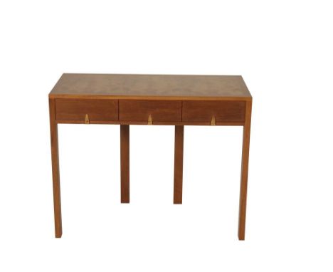 AFTER JOHN MAKEPEACE: A WALNUT VENEERED CONSOLE TABLE, the rectangular top with matched veneers above three flush fitting dra