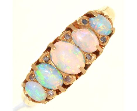 AN EDWARDIAN FIVE STONE OPAL RING WITH DIAMOND ACCENTS, IN 18CT GOLD, CHESTER 1901, 3.7G, SIZE O  One of the medium sized opa