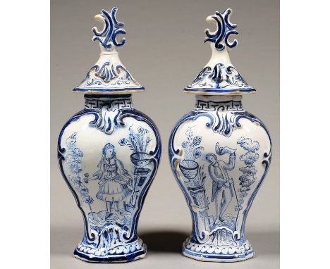 TWO DUTCH DELFTWARE VASES AND COVERS, THE VASES PAINTED WITH A LADY OR GENTLEMAN, 33CM H, 19TH C  Professional restoration to