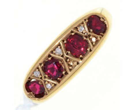 A GARNET AND DIAMOND RING, IN 18CT GOLD, BIRMINGHAM 1918, 4.1G, SIZE O  Lacks several of the chip diamonds