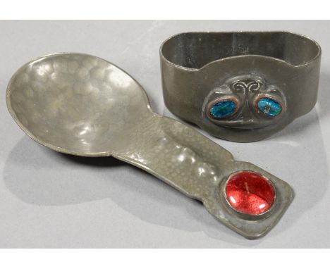 A LIBERTY AND CO PEWTER AND TRANSLUCENT ENAMEL NAPKIN RING, 5.5CM L, MAKER'S MARKS AND 0919, C1905 AND A CONTEMPORARY ARTS AN