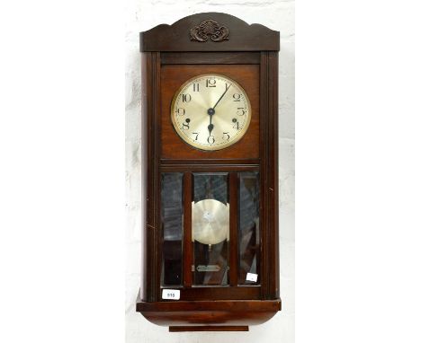 A GERMAN MAHOGANY STAINED WALL CLOCK WITH SILVERED DIAL, ROD GONGS AND BEVELLED GLASS LIGHTS TO THE DOOR, 76CM H, C1920  Smal