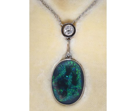 A BLACK OPAL AND DIAMOND PENDANT, MOUNTED IN WHITE GOLD ON INTEGRAL NECKLET, PENDANT 30MM, NECKLET APPROXIMATELY 350MM, IN LI