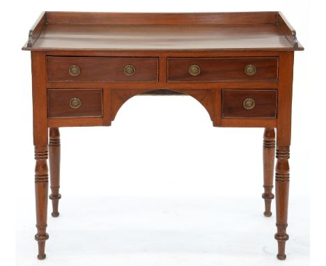 A VICTORIAN MAHOGANY WASHSTAND, FITTED WITH FOUR DRAWERS ABOUT THE ARCHED APRON, ON RING TURNED LEGS, 80CM H; 42 X 89CM  Rest