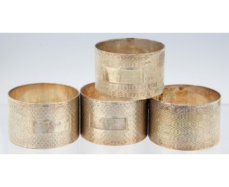 TWO PAIRS OF GEORGE VI SILVER NAPKIN RINGS, INITIALLED W AND ENGINE TURNED, BOTH BIRMINGHAM, MAKER H BROS, 1944 AND 1945, 4OZ