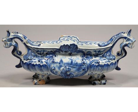 A DUTCH DELFTWARE DOLPHIN-HANDLED MINIATURE JARDINIERE, PAINTED TO EITHER SIDE WITH A SHIPPING SCENE, 31CM OVER HANDLES, PAIN
