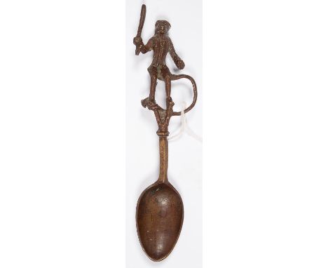 A NORTHERN EUROPEAN BRONZE FINGERIE SPOON, THE ANTHROPOMORPHIC HANDLE IN THE FORM OF A MONKEY HOLDING A CONDUCTOR'S BATON(?),