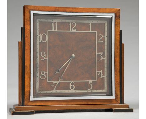 AN ART DECO WALNUT AND EBONISED MANTEL TIMEPIECE WITH SKELETONISED CHAPTER RING, 24.5CM H, CHROMIUM PLATED MOVEMENT STAMPED B