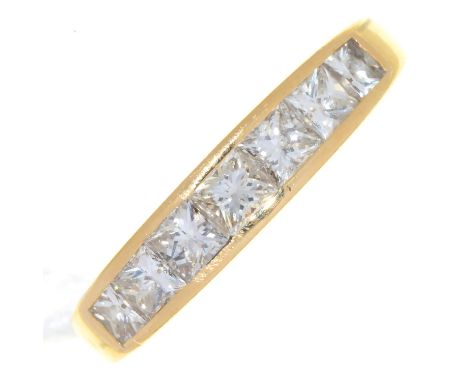 A DIAMOND SEVEN STONE RING, WITH PRINCESS CUT DIAMONDS, IN 9CT GOLD, BIRMINGHAM 2003, 4.3G, SIZE N  Good condition