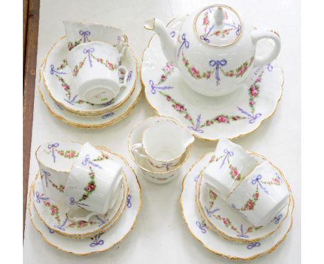 A COLLINGWOOD BROTHERS YORK PATTERN BONE CHINA TEA SERVICE, PRINTED AND PAINTED WITH FESTOONS AND LAVENDER BOWS, GLOBULAR TEA