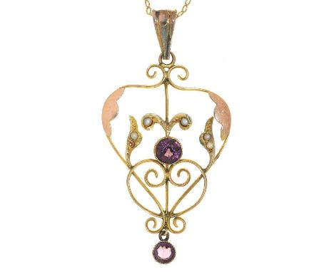 AN ART NOUVEAU AMETHYST, SPLIT PEARL AND TWO COLOUR GOLD OPENWORK PENDANT, 40MM EXCLUDING LATER GOLD LOOP, MARKED 9CT, C1910 