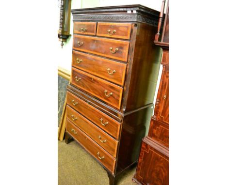 A crossbanded and string inlaid mahogany chest on chest raised on bracket feet