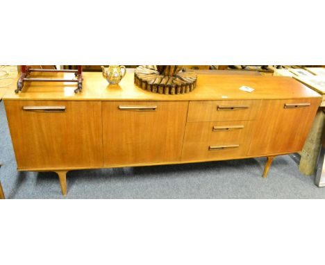 A 1960's teak sideboard, a teak extending dining table, two single chairs, an angle poise lamp on tripod base, a Triang toys 