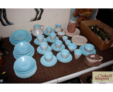 A quantity of Poole pottery twin tone dinner and teaware