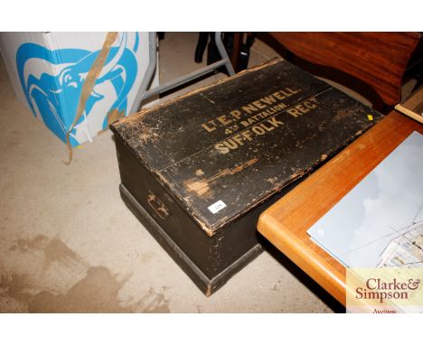 A painted campaign trunk, named for Lieutenant E P Newell, 4th battalion of the Suffolk regiment, with photograph of him on t