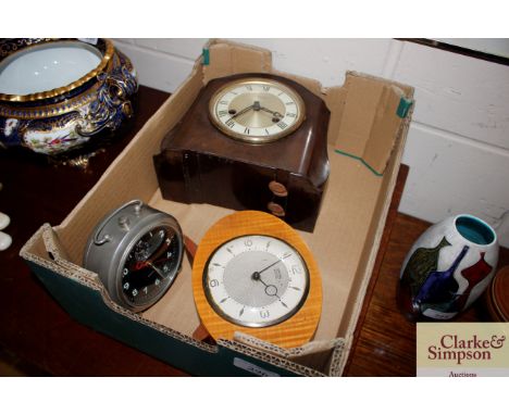 A Smith's Bakelite cased mantel clock, another Smith's mantel clock and an alarm clock