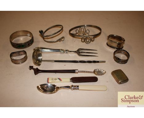 A 19th Century plated and twisted whalebone toddy ladle; two silver napkin rings; a plated vesta case; plated bread fork and 