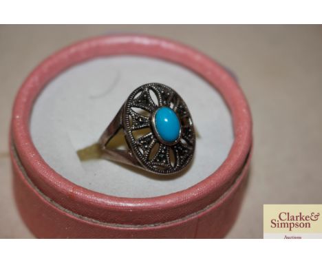 A silver marcasite and blue stone set dress ring 