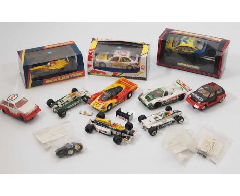 A group of mostly vintage SCALEXTRIC slot cars and accessories - F/VG in G boxes where boxed (10 cars plus accs)