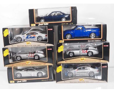 A mixed group of MAISTO 1:18 scale diecast cars including several racing examples - all as new - VG/E in VG boxes (7)