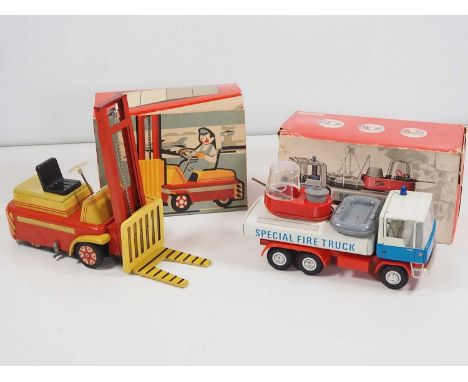 A pair of Czechoslovakian vintage tinplate and plastic friction drive vehicles comprising a working fork lift truck and a Spe