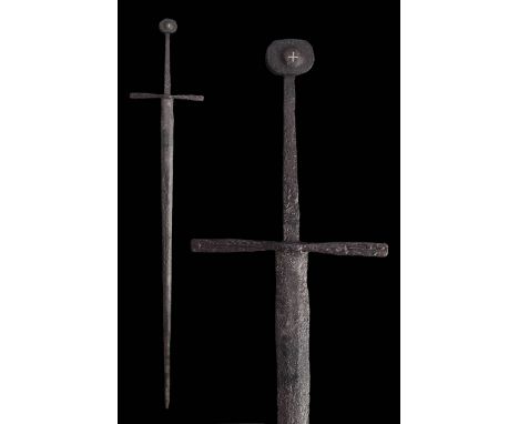 Circa 14th Century - Early 15th CenturyA stunning, forged-iron long sword with narrow and thin blade tapering to the point. T
