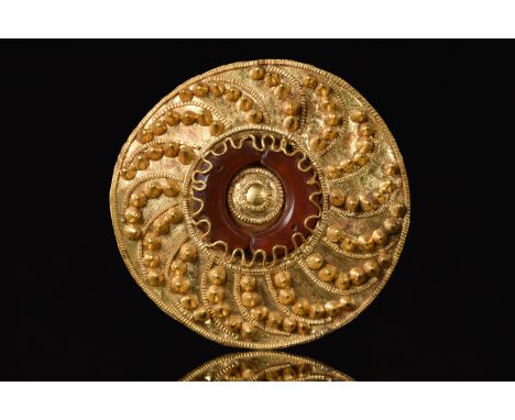 Circa 300-100 BC, Hellenistic PeriodA finely rendered Greek Hellenistic gold disc-shaped brooch/pendant, hammered from thin g