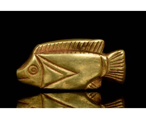 Circa 1550-1070 BC, New KingdomA golden amulet in the shape of a tilapia fish. Fish pendants were worn as jewellery and were 