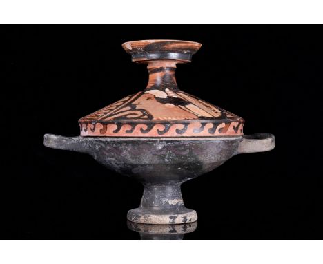 Circa 340-325 BCAn Apulian red-figure ceramic lekanis; red-figure lid with two female profile heads between palmettes and sty