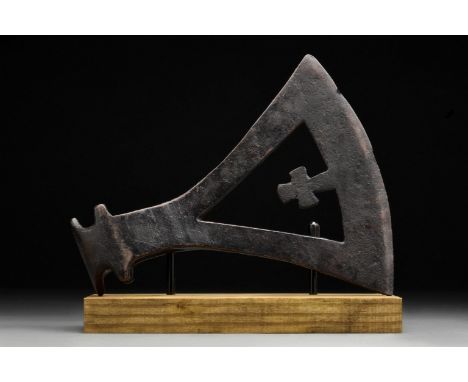 Circa 900-1100 ADA hand-forged iron axe head with substantial curved blade with cut-out openwork section with a cross and ell