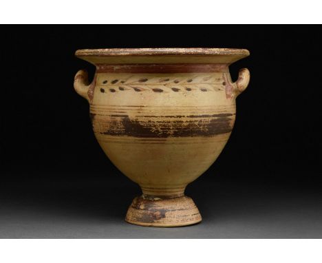 Circa 300-350 BCA finely modelled Daunian pottery krater with a large, rounded body, a broad funnel rim, and twin upraised ha