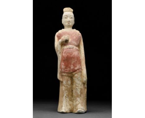 Circa 386-534 ADA well defined Chinese Northern Wei Terracotta Attendant Statue. The Figure is depicted standing with his han