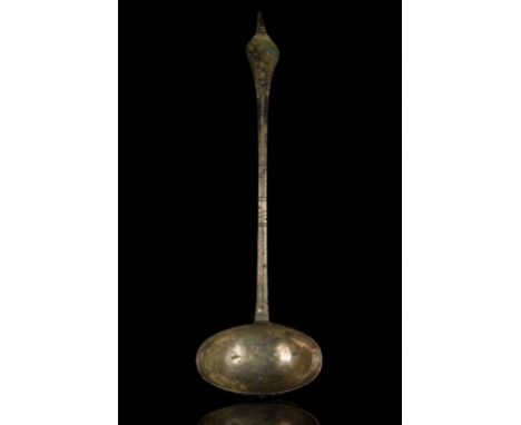 Circa 1100 ADA nicely patinated ladle with oval-shaped bowl, the flat handle has been punched with incised decoration of ring
