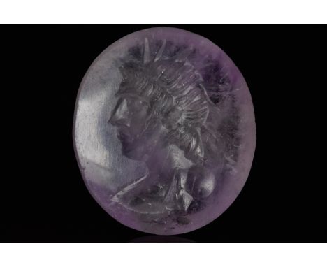 Circa 300-400 ADAn oval amethyst intaglio of a draped bust of Sol Invictus with radiate crown. Sol Invictus (Latin for: "Unco