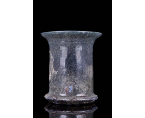 Circa 200-300 ADA finely modelled Roman clear glass beaker with a slight light green tinge. The rolled rim of the beaker is s