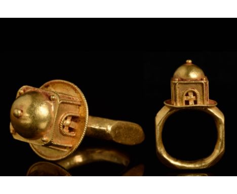 Circa 600 ADA gold ring with bezel in the form of a round and domed building, possibly a church, with series of arches to the